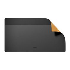 a black mouse pad with an orange paper sticking out of the back side of it