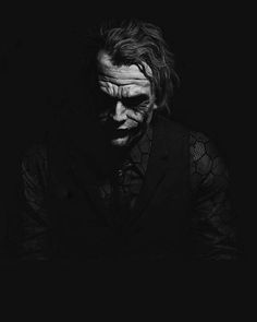 the joker in black and white, with his face painted like a man's face