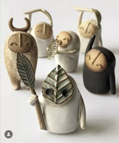 small ceramic figurines in different shapes and sizes