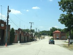 a car is parked on the side of an empty street