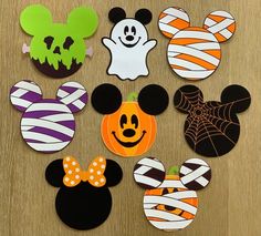 mickey mouse and other halloween decorations on a table