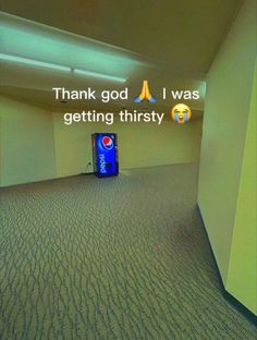 an empty room with a blue box on the floor and a thank god i was getting thirsty sign above it