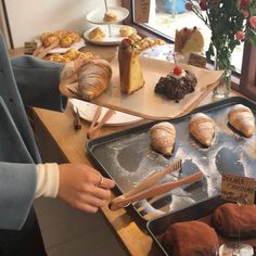 there are many pastries on the trays ready to be eaten at this restaurant