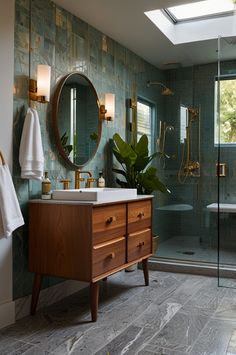 a bathroom with a sink, mirror and bathtub in the corner next to a walk - in shower