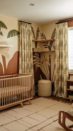 a baby's room decorated with palm leaves