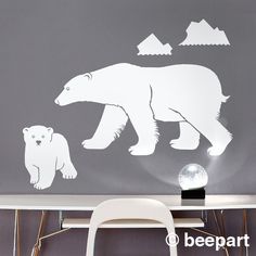 a white bear and cub wall decal sitting on top of a table