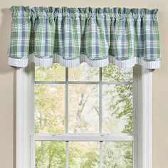 a window with a green and blue checkered valance