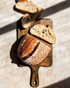 two loaves of bread on a cutting board