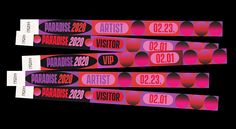 three red and pink tickets with the names of various artists on them, in front of a black background