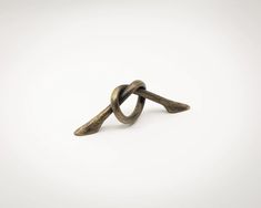 an oxen ring with twisted ends on a white background