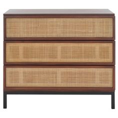 the three drawers are made from rattan and wood, with one drawer open to show an