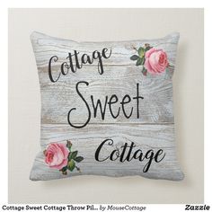 a pillow that says cottage sweet cottage with pink roses on the front and black lettering