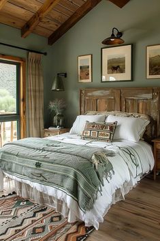 a bed sitting in a bedroom on top of a wooden floor next to a window