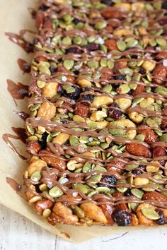 there are nuts and chocolate drizzled on top of each other in this dessert