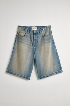 Oversized BDG baggy jorts in premium BDG denim. Longline denim shorts with a relaxed fit and zip fly. Urban Outfitters exclusive. Features BDG Astro baggy washed denim jorts Longline denim shorts Mid rise waist Rigid BDG denim Loose longline fit 5-pocket; zip fly UO exclusive Content + Care 100% Cotton Machine wash Imported Size + Fit Model in Dark Green 6'1.5" and wearing size 32 Measurements taken from size 32 Rise: 14" Inseam: 11.5" Leg opening: 12.5" | BDG Astro Baggy Washed Denim Jort in Li Streetwear Shorts With Five Pockets, Five-pocket Streetwear Shorts, Medium Wash Five Pocket Shorts For Streetwear, Medium Wash Five-pocket Shorts For Streetwear, Streetwear Short Length Jean Shorts With Five Pockets, Jean Shorts With Five Pockets For Streetwear, Denim Jorts, Baggy Denim, Blue Fits