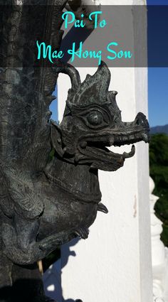 a statue of a dragon with the words piu to mae hong son