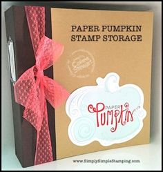 a brown paper pumpkin stamp storage box with pink ribbon on the front and bottom side