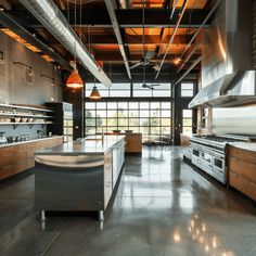 An industrial kitchen with wide walkways and ample space around the island, allowing for smooth traffic flow3 Industrial House Kitchen, Chic Kitchen Design, Industrial Chic Kitchen, Kitchen Hood Design, Designing A Kitchen, Reclaimed Wood Floors, Industrial Home Design