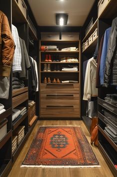 a walk - in closet with lots of clothes and shoes on the shelves, along with an area rug