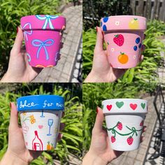 four different colored cups with designs on them in front of some bushes and trees,