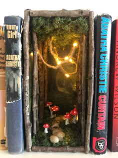 A book nook shelf insert that gives the illusion of a miniature fairy forest with mushrooms and a pebbled path between your books. Anting Manik, Hantverk Diy, Diy Crafts To Do, Book Nook, Book Case, Fun Diy Crafts, Book Nooks, Cute Crafts