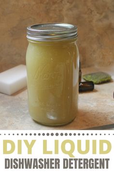 a jar filled with liquid sitting on top of a counter