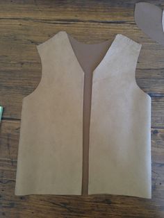 a piece of paper is cut out to look like a vest