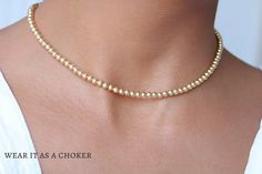 "A dainty, feminine, and adjustable 18k Gold laminate layering necklace.  Please note: this listing is for one chain only. The model in the pictures is layering it with other necklaces. Layer it too and take your outfit to the next level!  D E T A I L S  * Box Link Balls Necklace. * Material: 18k Gold Filled laminate * Chain Width: 1mm. * Beads Measure: 4mm. * Fine finish   C H A I N  L E N G T H  14.5\" long  plus adjustable 4\" extension.  18K  G O L D  F I L L E D   Fine finish 18k gold-fille Dainty Gold Beads Choker As A Gift, Dainty Gold Beaded Choker As Gift, Dainty Gold Choker With Round Beads, Dainty Gold Beaded Choker, Delicate Gold Choker With Tiny Beads, Hare Necklace, Leaping Hare, Running Hare, Rabbit Necklace