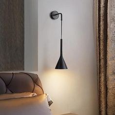 a lamp that is on the side of a wall