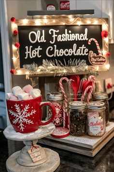 an old fashioned hot chocolate bar is decorated with candy canes and marshmallows