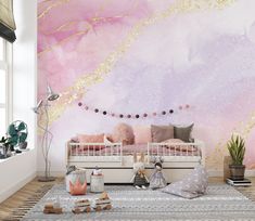 a bedroom with pink and gold wallpaper on the walls, white bedding and rugs