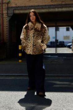 Make a leopard print statement in our new favourite coat by Silence + Noise. The fluffy faux fur coat features a spread collar, drop shoulders, long sleeves, a zip-through fastening and side pockets, all in a boxy, oversized silhouette. UO exclusive. **Content + Care** \- Fabric one: 42% Polyester, 34% Acrylic, 24% Modacrylic \- Fabric two: 100% Cotton \- Lining: 100% Polyester \- Contains 100% Recycled Polyester \- Dry clean only **Size + Fit** \- Model is 167cm/5'6" and wearing size Small \- U Product Moodboard, Leopard Print Fur Coat, Leopard Print Faux Fur Coat, Leopard Fur Coat, Fur Lined Coat, Leopard Coat, Leopard Print Coat, Leopard Jacket, Fluffy Coat