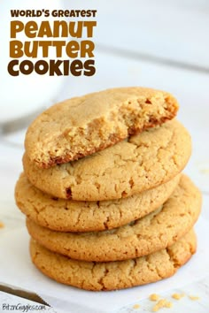 a stack of peanut butter cookies sitting on top of a white plate with the words world's greatest peanut butter cookies