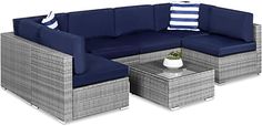 an outdoor furniture set with blue cushions