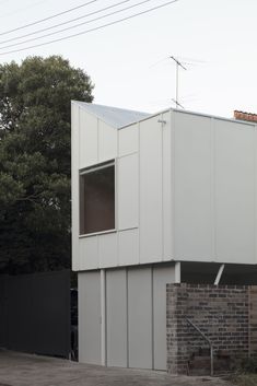 a white building with windows on the side of it