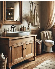 a bathroom with a sink, toilet and mirror in it's centerpieces