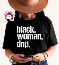 Black Woman DNP shirt,Black woman doctor of nursing practice shirt,Black woman graduation gift,African woman graduation,Womans day shirt https://etsy.me/349fSXd  PRODUCT DESCRIPTION WARNING: Please be aware these shirts are unisex model, for women suggested 1 (or 2) size down. Please check the colors and sizes on the images! .: Retail fit .: 100% Soft cotton (fibre content may vary for different colors) .: Light fabric (4.2 oz/yd² (142 g/m .: Tear away label .: Runs true to size Machine wash: warm (max 40C or 105F); Non-chlorine: bleach as needed; Tumble dry: low heat; Iron, steam or dry: medium heat; Do not dryclean 100% Combed ring spun cotton Made by specially treating the cotton fibers before spinning them into yarn. The result is stronger and smoother fabric. Twill tape covers the sho Black Woman Graduation, Educated Black Woman, Phd Shirt, Doctorate Graduation, Doctor Of Nursing Practice, Graduation Pic, Kindergarten Teacher Shirts, Science Shirts, Women Nurse