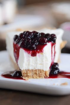 the best no - bake cheesecake with blueberries is on a white plate