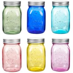 four different colored mason jars with lids