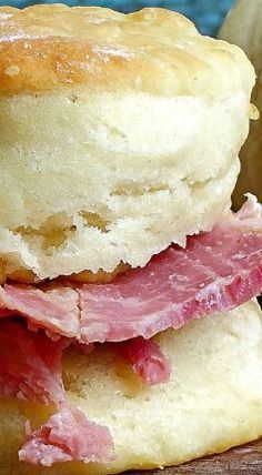 a ham and cheese biscuit is stacked on top of each other