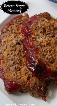 Two slices of meatloaf on a white plate.