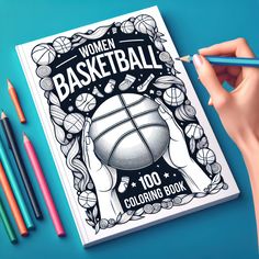 a woman's hand holding a pencil over a book with basketball illustrations on it