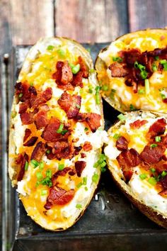 bacon and cheese stuffed potatoes on a baking sheet