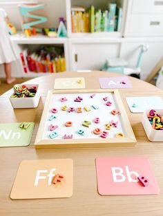 a wooden table topped with lots of magnets on top of it's sides