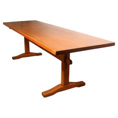 a wooden table sitting on top of a white background