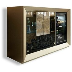 an open refrigerator with wine glasses on the door and bottles in it's display case