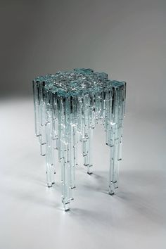 an unusual glass table with multiple legs