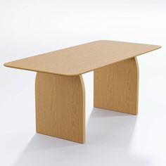 a wooden table sitting on top of a white floor