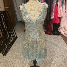 Light Blue And Silver Homecoming Dress. Worn Only Twice. Super Sparkly Light Blue V-neck Evening Dress For Party, Light Blue V-neck Party Evening Dress, Light Blue Sequined Prom Evening Dress, Sparkling Silver Sequin Dress For Homecoming, Silver Sparkling Sequin Dress For Homecoming, Glamorous Light Blue Evening Dress For Party, Sparkling V-neck Dress For Homecoming, Silver Sequin Dress For Homecoming, Elegant Silver Sequin Homecoming Dress