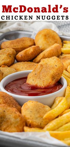 fried chicken nuggets with ketchup in a pan